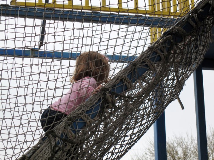 Amber climbs the jungle gym